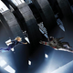 A woman without a helmet floats toward an astronaut on the cover of sci-fi novel Braking Day.